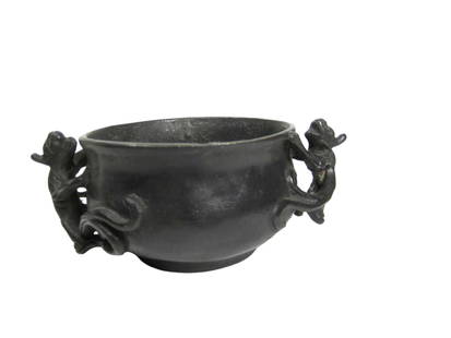 A  Chinese Bronze Censer with Dragon Handles: A compact Chinese bronze censer measuring 2 in. high by 4 in. wide, featuring twin handles shaped as stylized dragons. The piece has a dark patina and bears a Ming dynasty-style Xuande mark on the bas