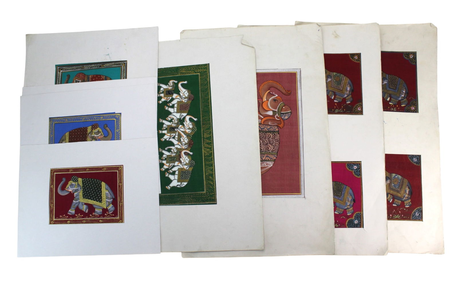 Set of Eight South Asian Silk Elephant Paintings: Set of eight matted South Asian silk paintings, each showing richly adorned elephants with gilt details. Bright colors remain, with minor creases, stains, and edge wear. Largest matting approx. 14 in.