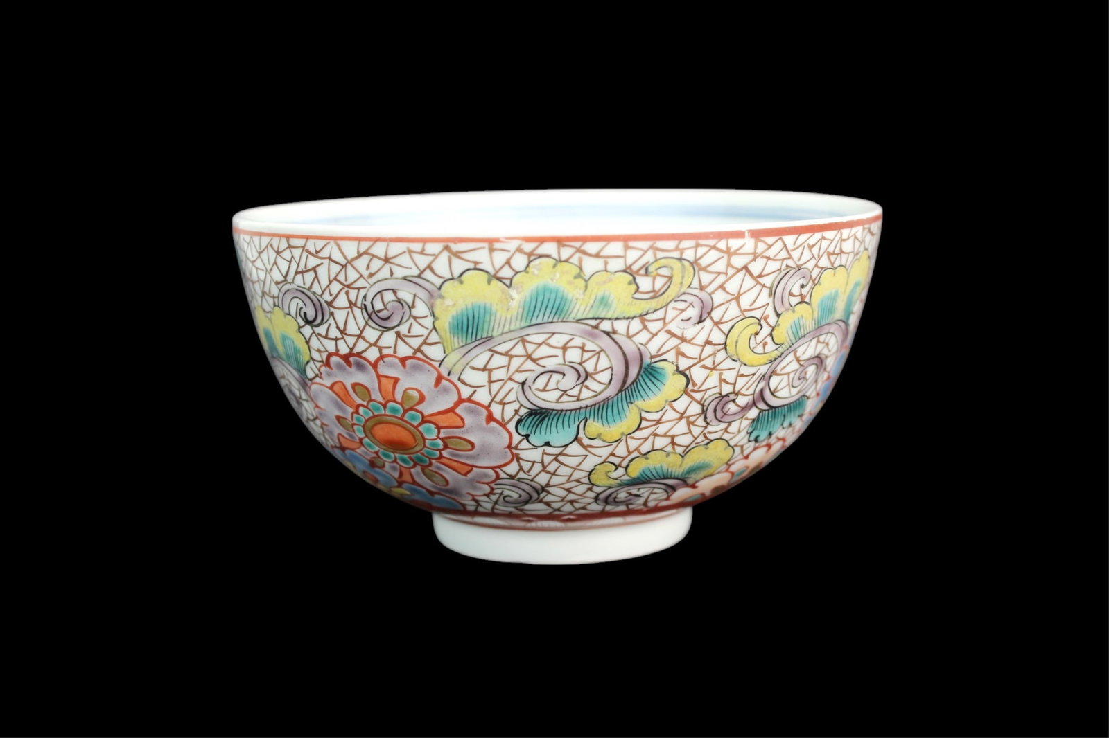A Chinese Famille Rose Bowl: Famille rose porcelain bowl with floral scrolls on a crackled ground and a blue underglaze lion medallion inside; marked base with old “1825 AD” label. Measures approx. 5 in. (D) x 2 1/2 in. (