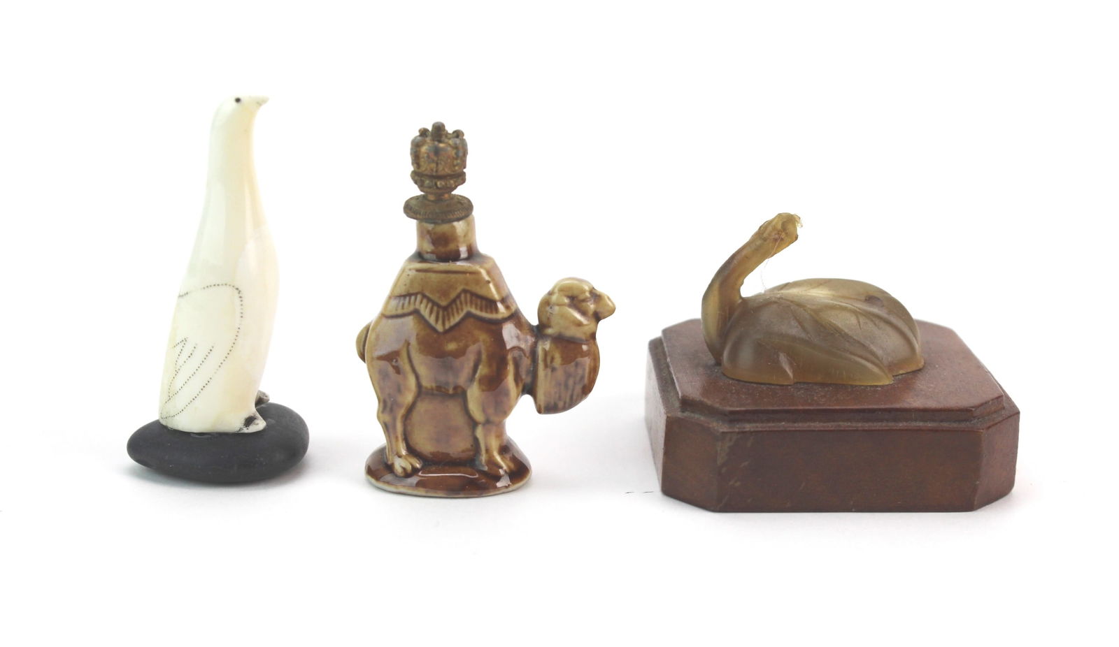 Miniature Penguin, Perfume Bottle & Goose: Group of three miniatures—a bone penguin on base, German camel-form perfume bottle with worn metal crown stopper, and carved goose with damaged head. Light wear and age marks overall. Heights: 2&fra