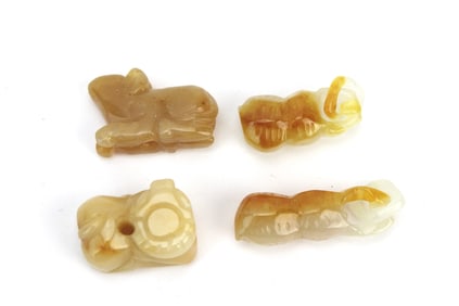 Group of Four Small Jade Pendants
