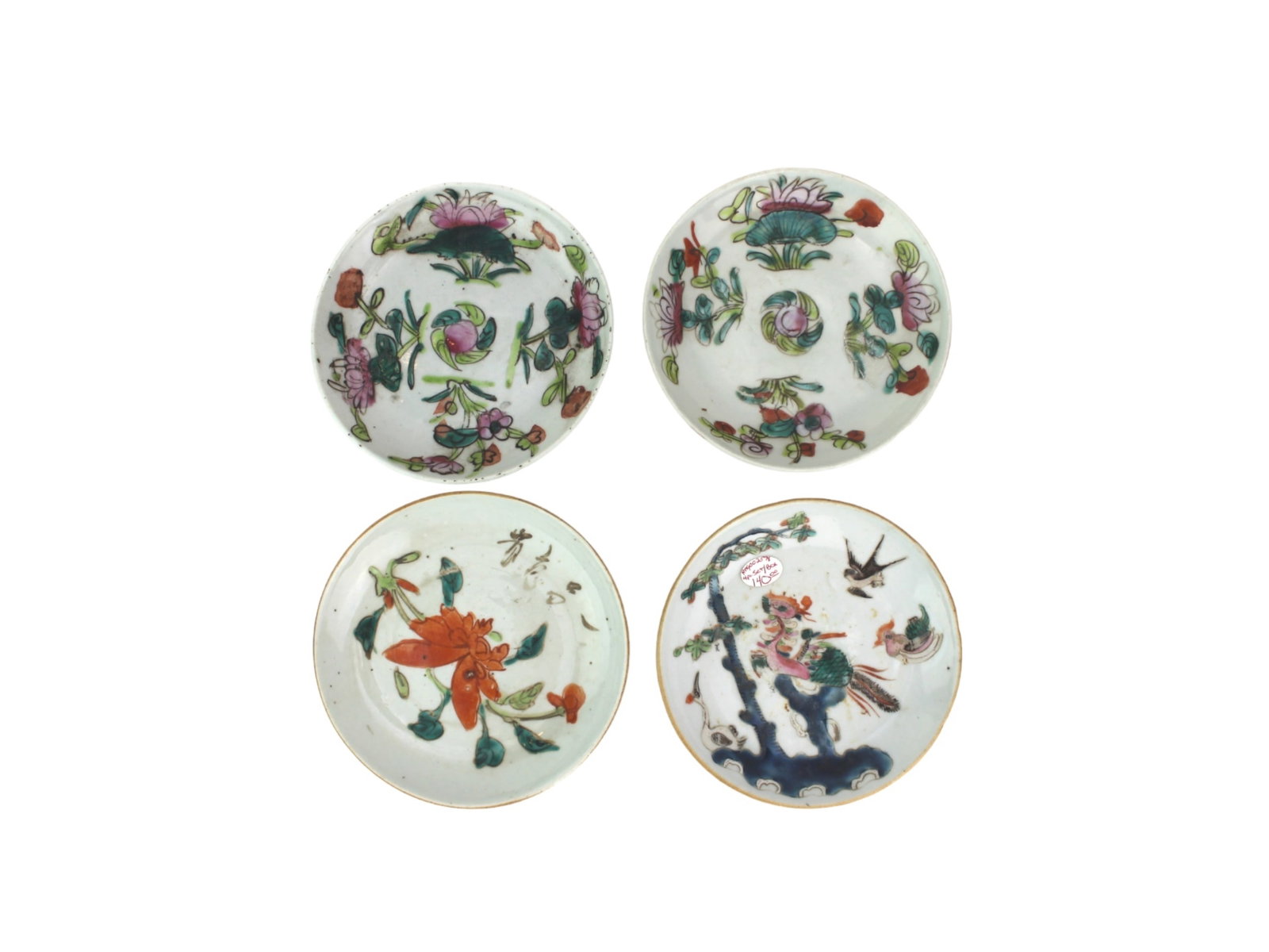 Four Chinese Famille Rose Dishes: Set of four 5-inch antique Chinese famille rose dishes with floral and bird motifs. Each has wear, scratches, and minor chips, showcasing age and use.