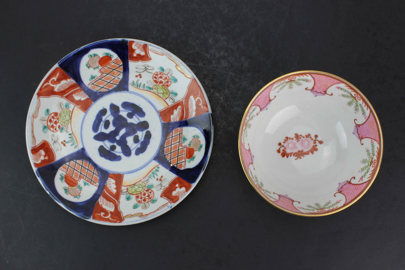 Chinese Export Bowl & Imari Porcelain Plate: Two porcelain items: a Chinese export bowl (6 in. D × 2 3/4 in. H) and an Imari plate (8 1/2 in. D), in overall good condition with minor wear, glaze imperfections, and light scratches consistent
