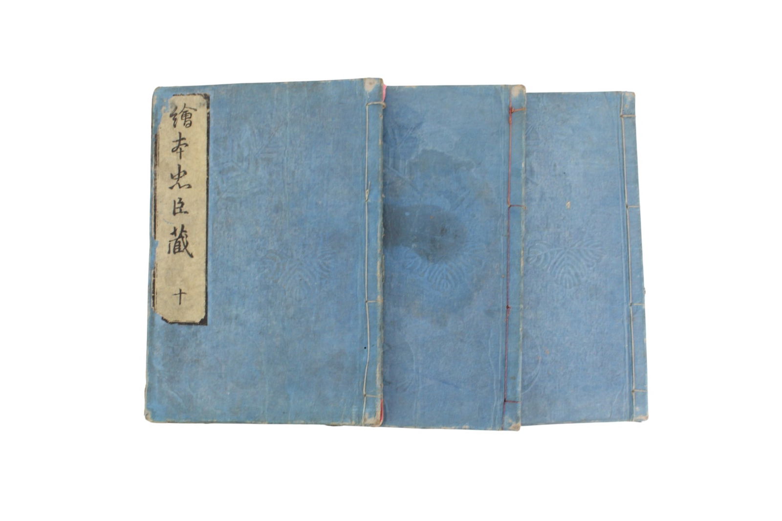 3 Vols. Illustrated Chushingura, Japan 1800: Three volumes of The Illustrated Story of Chushingura (Kansei 12, 1800), Japanese woodblock-printed books with stitched blue paper covers and black-and-white illustrations. Size: 6 X 8 1/2 X 1 in.