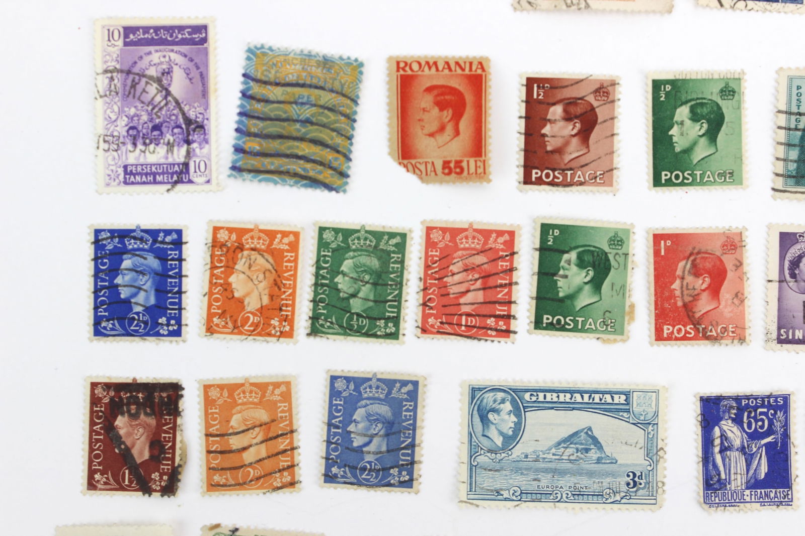 100+ Assorted International Postage Stamps - 4