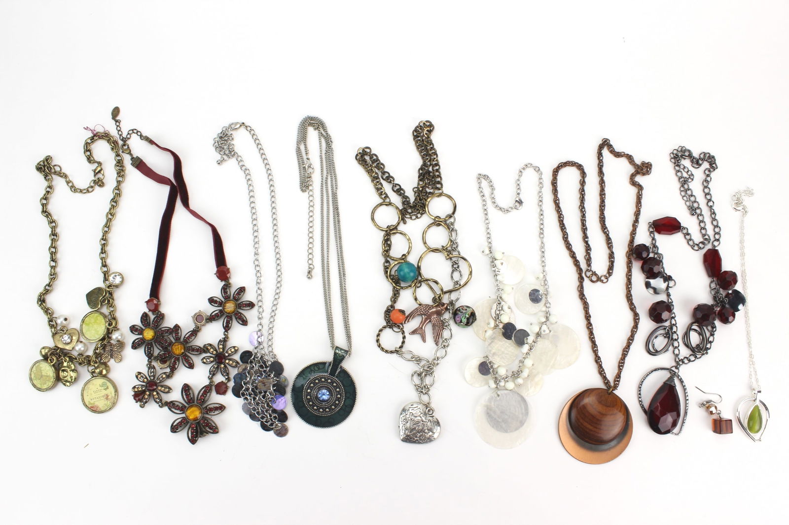 Group of Fashion Costume Necklaces: An assorted group of fashion costume necklaces in mixed designs, featuring chain, pendant, bead, and charm styles in varied colors and finishes. Largest necklace measures approx. 20 in. (L). Overall