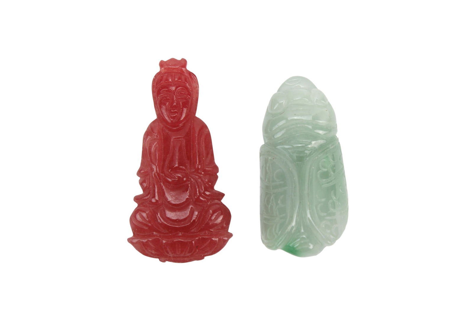 Two Carved Jade Pendants, Buddha & Cicada: Two carved jade pendants depicting a seated Buddha (38.8 mm L) and a cicada (34.8 mm L), in good condition with natural color variations, light surface wear.