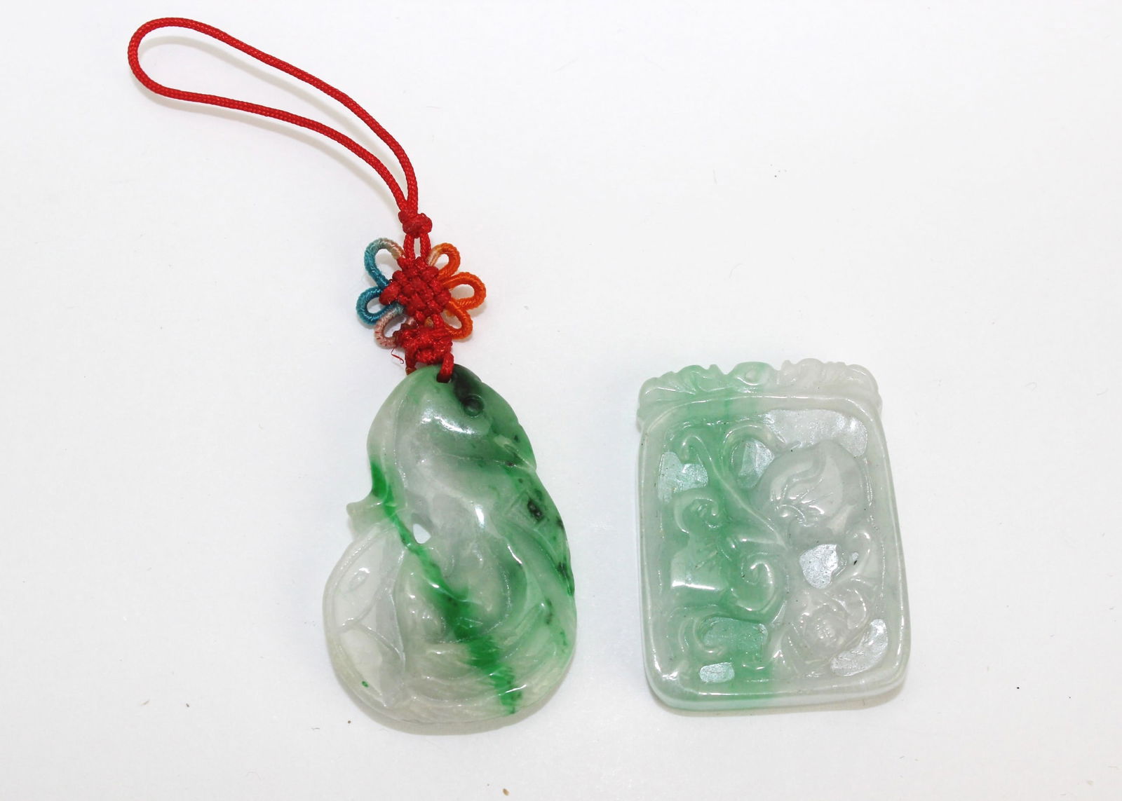 Two Carved Jadeite Pendants - 2