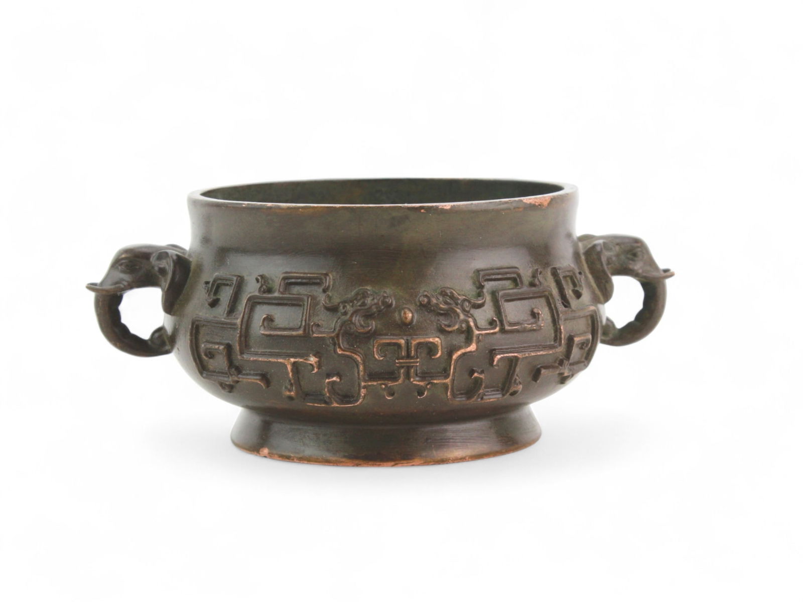 Chinese Bronze Censer with Elephant Handles: Small Chinese bronze censer featuring elephant-head handles and raised archaic patterns. Measures approximately 4 inches in diameter and 2 inches high. With six character Xuande mark on the base.