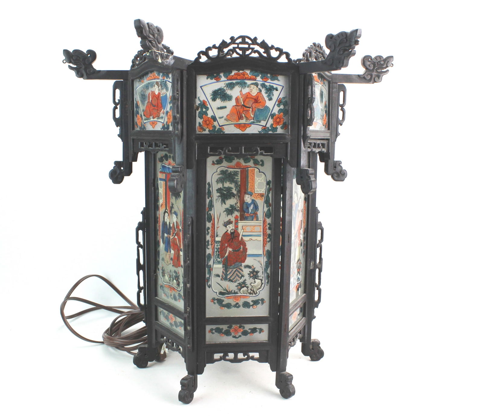 Chinese Lantern w/ Reverse Painted Glass: Chinese lantern featuring multiple reverse-painted glass panels depicting traditional figural scenes, set within an ornate dark wood frame with carved dragon-form brackets and pierced gallery. Electri