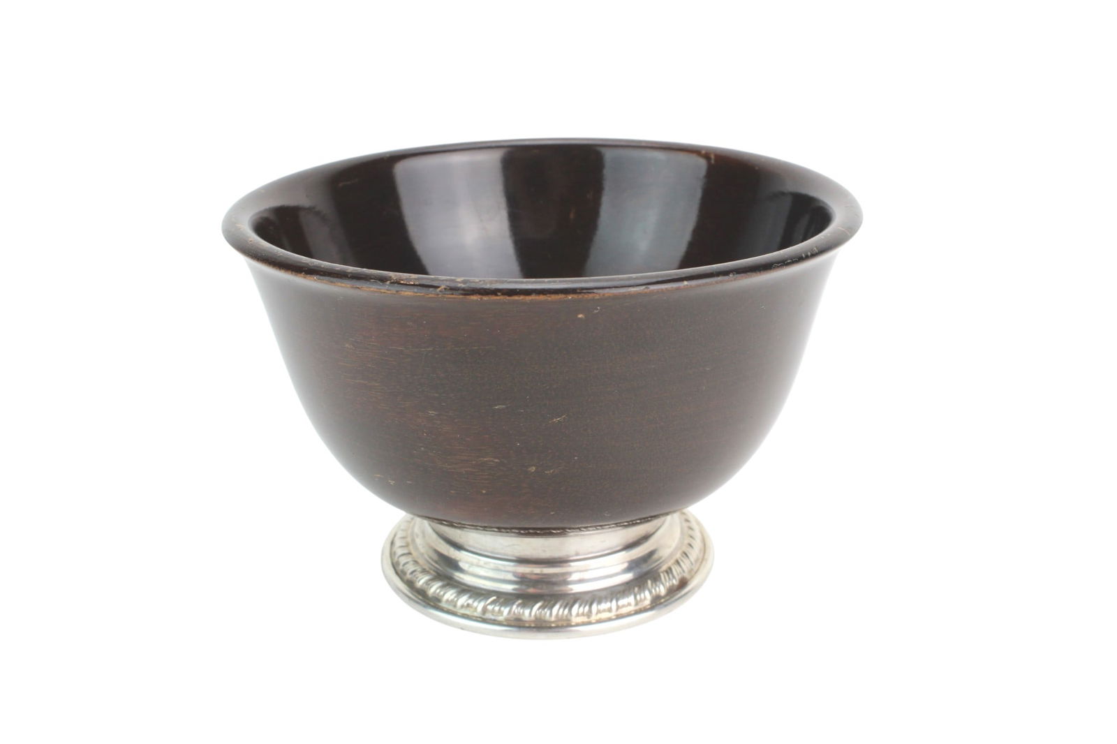 Revere Style Wood Bowl With Sterling Base: Sterling-mounted Revere-style wooden bowl with a dark finished wood body and classic silver base. The sterling base weighs approx. 21 grams and is marked “STERLING.” Measures approx. 5 1/2