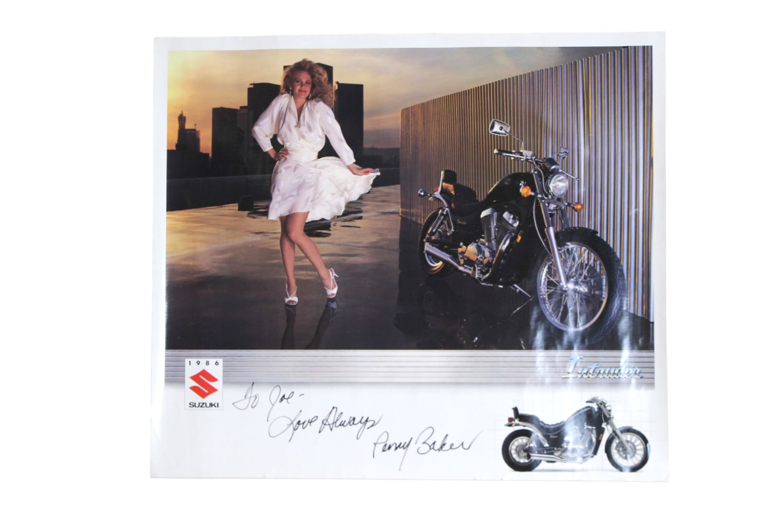 Signed Suzuki Intruder Motorcycle Poster: Large promotional Suzuki motorcycle poster, signed by model Penny Baker in marker. Features a studio-style image of the Suzuki Intruder with model and branding details. Measures approximately 25 X 28