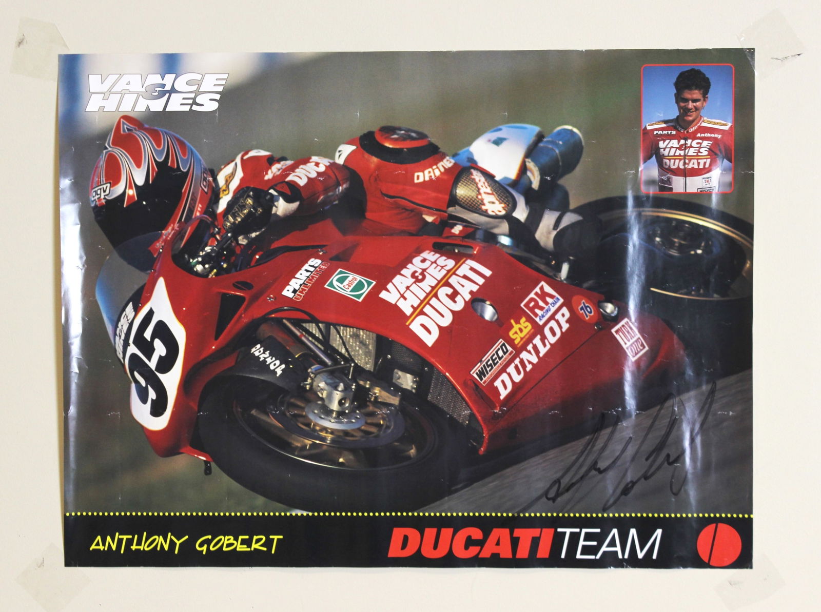 Anthony Gobert Signed Ducati Racing Poster: Original motorcycle racing poster featuring Anthony Gobert riding for the Ducati team, boldly signed by Gobert in black marker. Measures 24 × 18 in. Overall condition is good, with visible handling