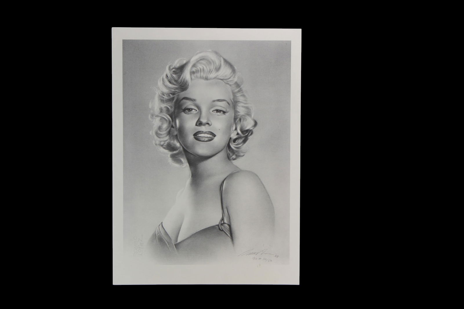 Romeo Lopez Marilyn Monroe Limited Lithograph: A signed limited edition lithograph depicting a portrait drawing of Marilyn Monroe by Romeo Lopez. Pencil-signed and numbered A/P 30/50, 88 in the lower margin. The lithograph measures approx. 16 X