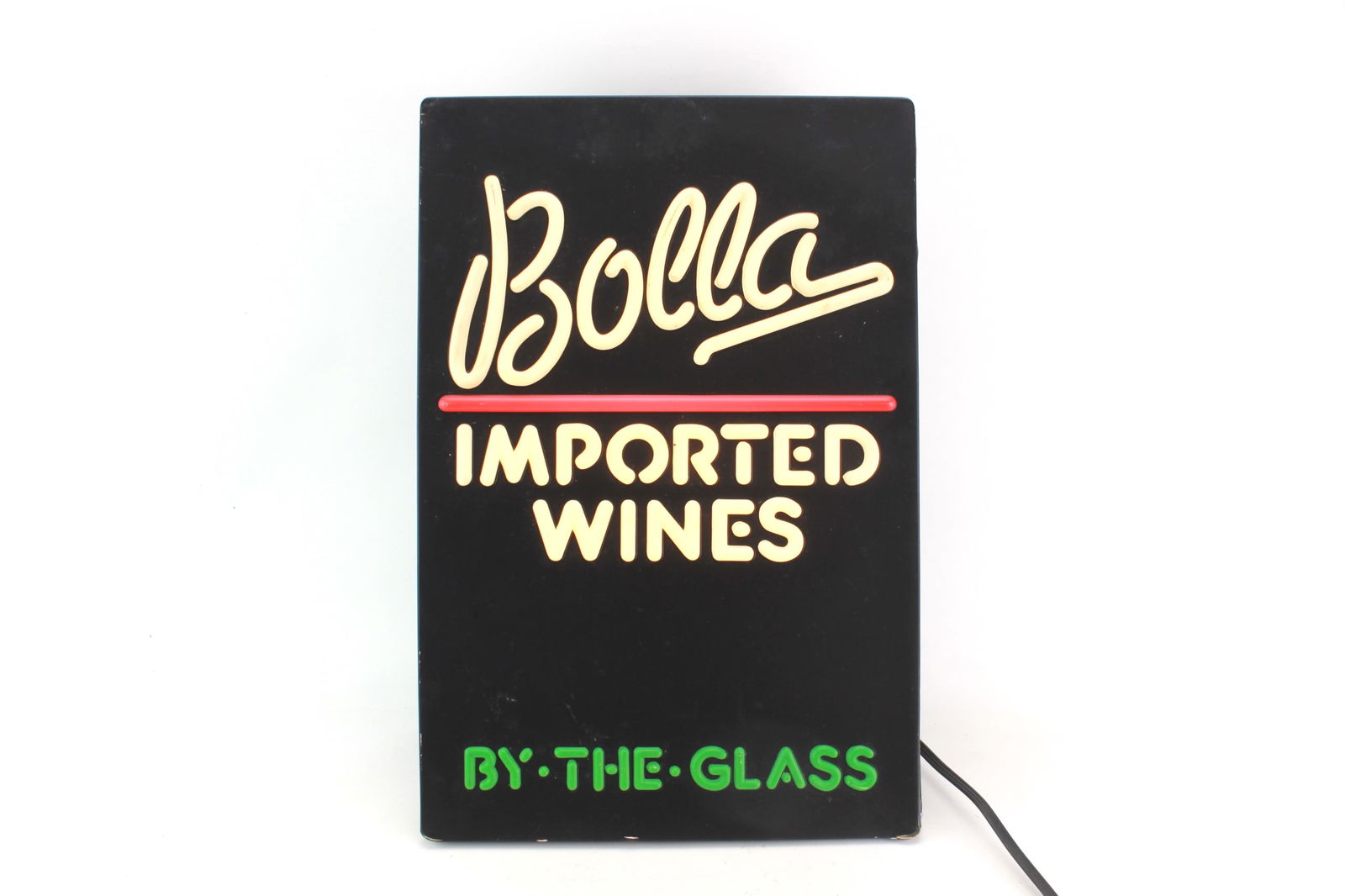 Bolla Imported Wines By The Glass Light Up Sign: Vintage electric bar sign for Bolla Imported Wines with illuminated raised lettering. Designed for indoor use, it shows minor corner wear and includes a UL label.Dimensions: 18 1/2 in. (L) X 12 in.