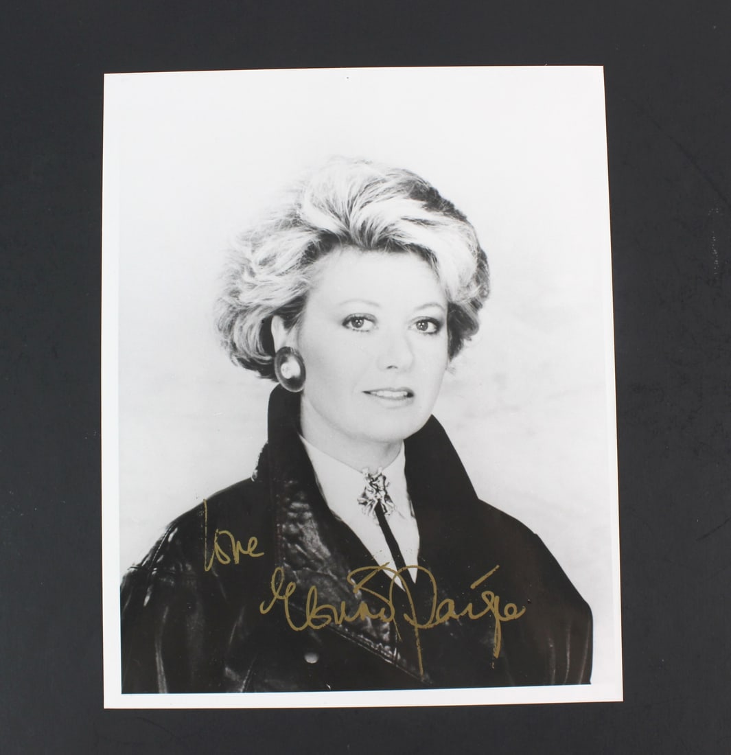 Elaine Paige Signed B&W Portrait Photo: Black-and-white 8 × 10 in. glossy photo of British musical theatre star Elaine Paige, signed in gold ink with the inscription “Love, Elaine Paige.” Features a studio portrait of Paige in a