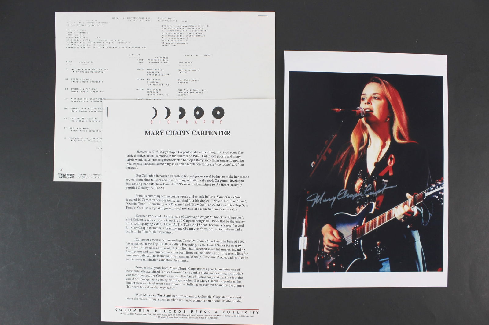 Collectibles for Mary Chapin Carpenter: Lot includes an 8 × 10 in. color photo reprint of Mary Chapin Carpenter performing live, bearing her signature, along with original Columbia Records promotional materials and recording sheets from he