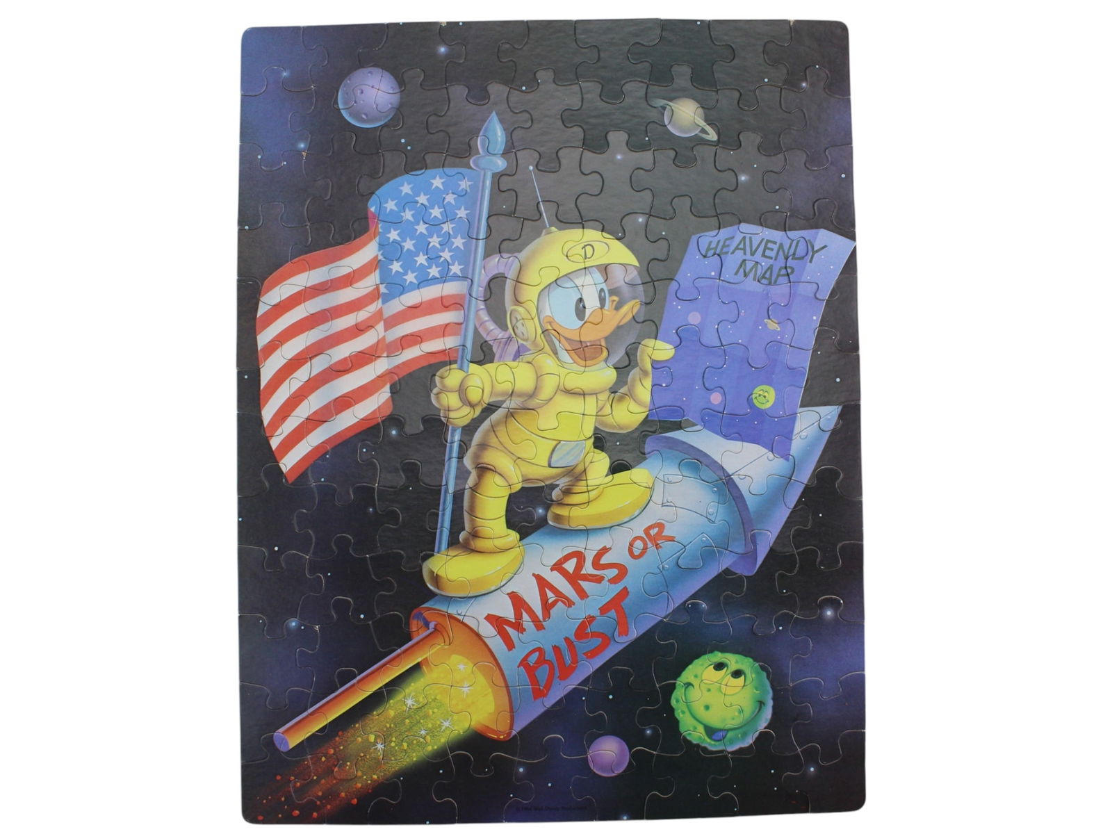 1984 Walt Disney Donald Duck Space Puzzle: Vintage 1984 jigsaw puzzle featuring Donald Duck in a space suit, holding an American flag and a "Heavenly Map" while riding a rocket labeled Mars or Bust. Produced by Walt Disney Productions.