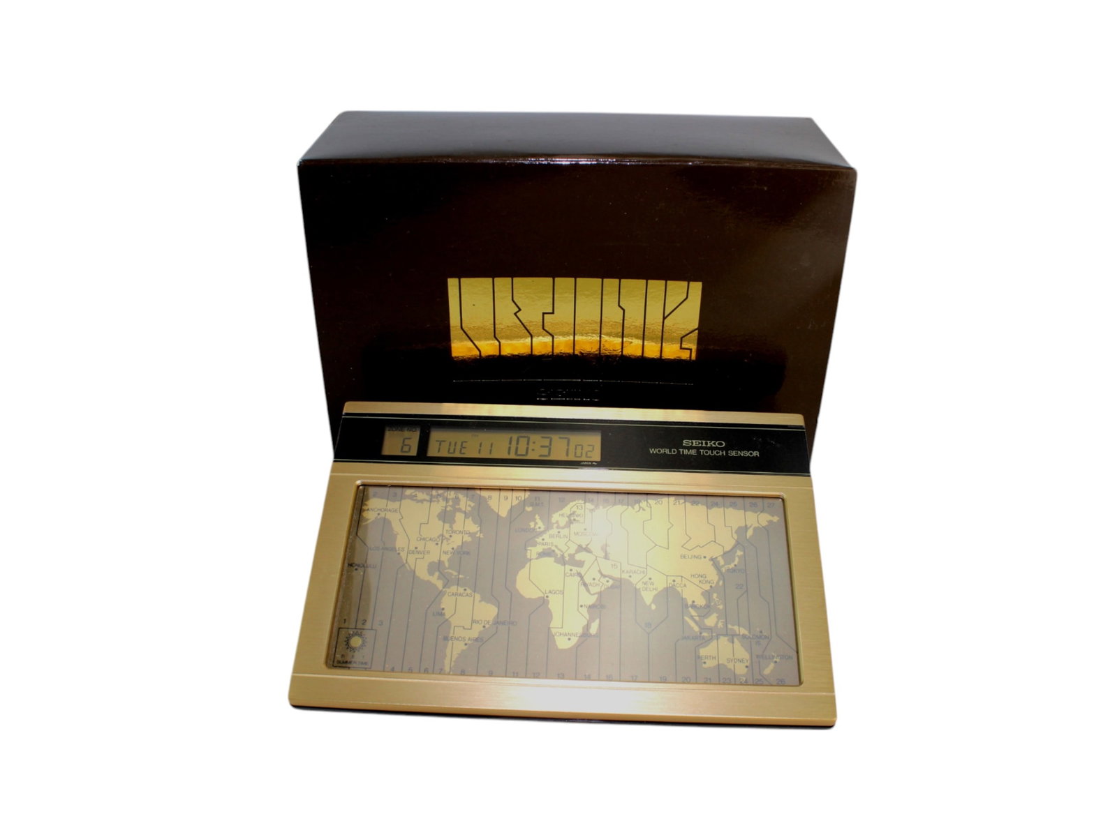 Seiko World Time Touch Sensor Digital Quartz Clock: Seiko EK401G digital quartz world clock with touch sensor, showing time in 27 time zones. Includes daylight saving, auto calendar (1986–2035), original box, manual, and papers. Made in Japan. In wor