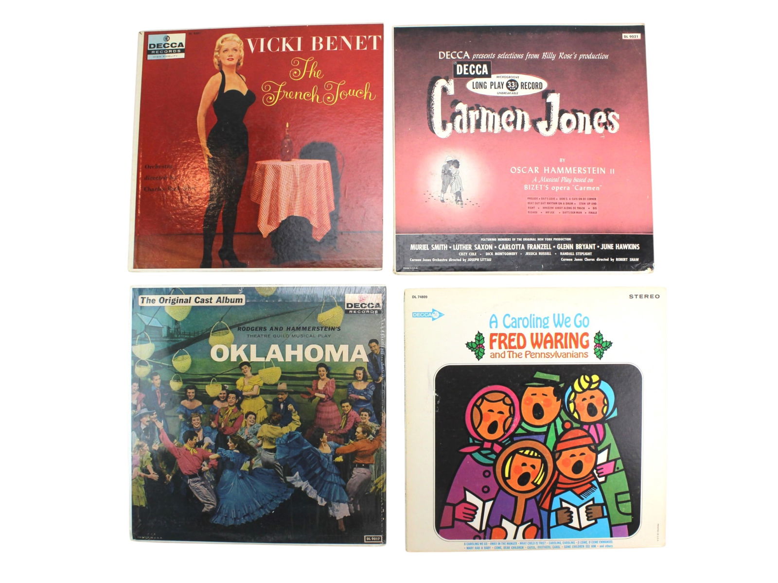 Vintage DECCA Vinyl Collection – 4 Classic Albums: A group of four vintage Decca vinyl records, including Vicki Benet – The French Touch, Oscar Hammerstein II – Carmen Jones, Rodgers & Hammerstein – Oklahoma!, and Fred Waring – A Caroling We G