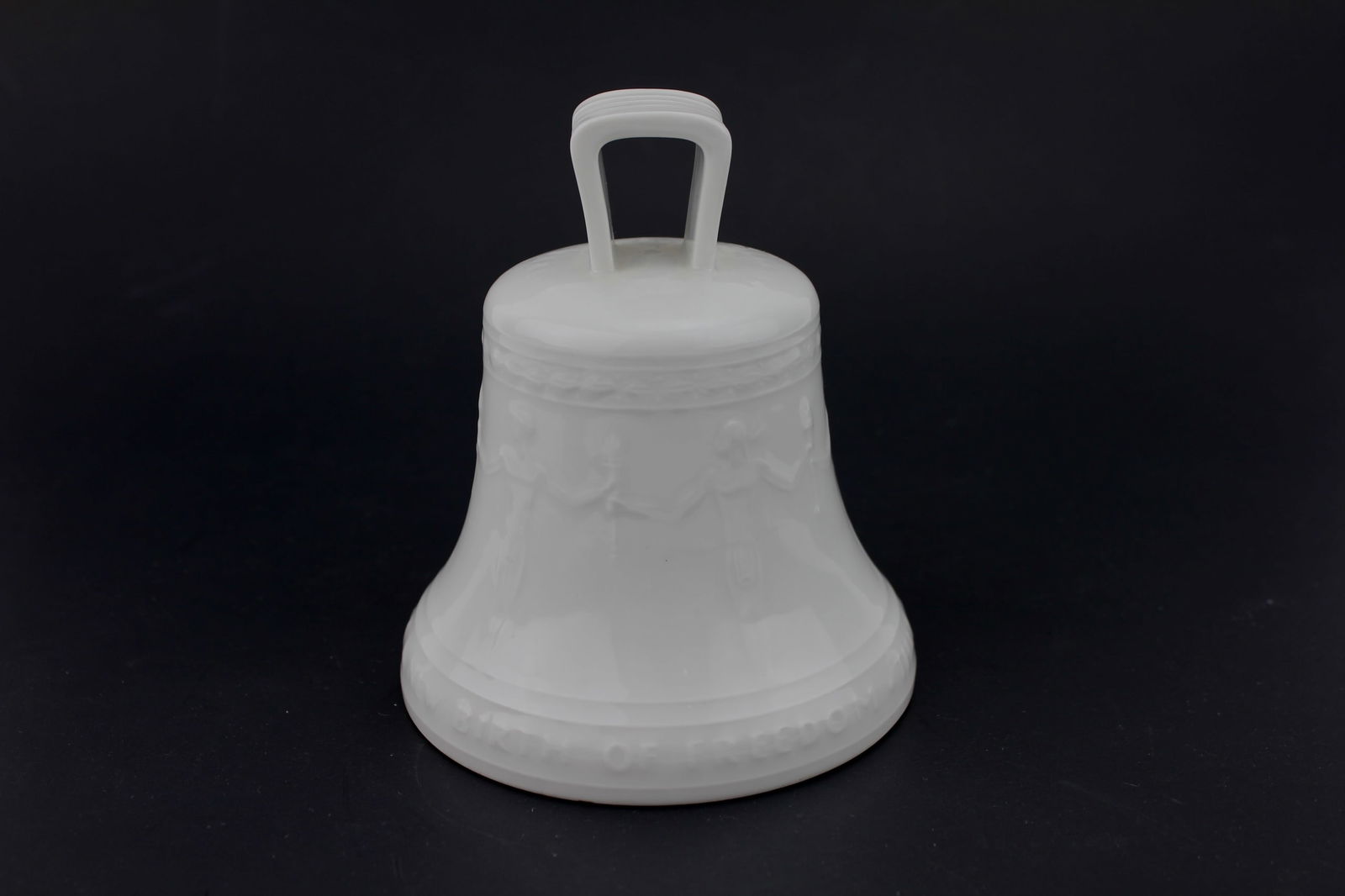 KPM WHITE PORCELAIN BERLIN FREEDOM BELL: White porcelain commemorative bell made in Berlin, dated October 24, 1950. Features embossed figures and the phrase “Birth of Freedom – That the World Under God Shall Have a New Birth of Freedom.&
