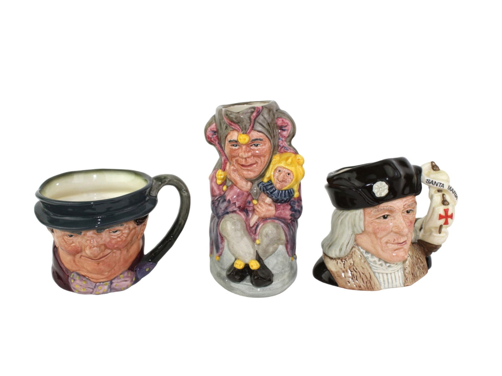 Set of 3 Royal Doulton Character Toby Jugs: A trio of collectible Royal Doulton character jugs, including “Christopher Columbus” (D6911), “The Jester” (D6803), and a smaller jug marked with “A.” Each hand-painted ceramic
