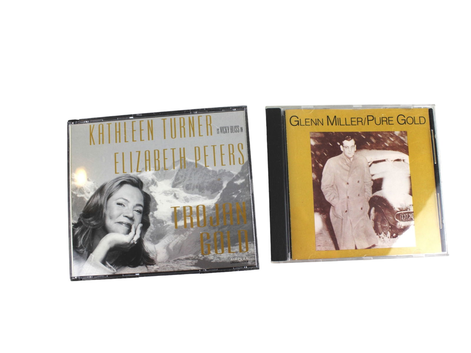 Two Sets of Audio CDS: Including: (1) Kathleen Turner is Vicky Bliss in Elizabeth Peters-Trojan Gold (4 CDs); (2) Glenn Miller/Pure Gold.