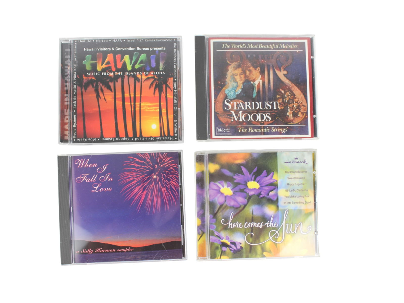 Four Music CDs: Including: (1) Music From The Islands of Aloha, Hawai'i Visitors & Convention Bureau Presents; (2) When I Fall In Love, A Sally Harmon Sampler; (3) The World's Most Beautiful Melodies, Stardust