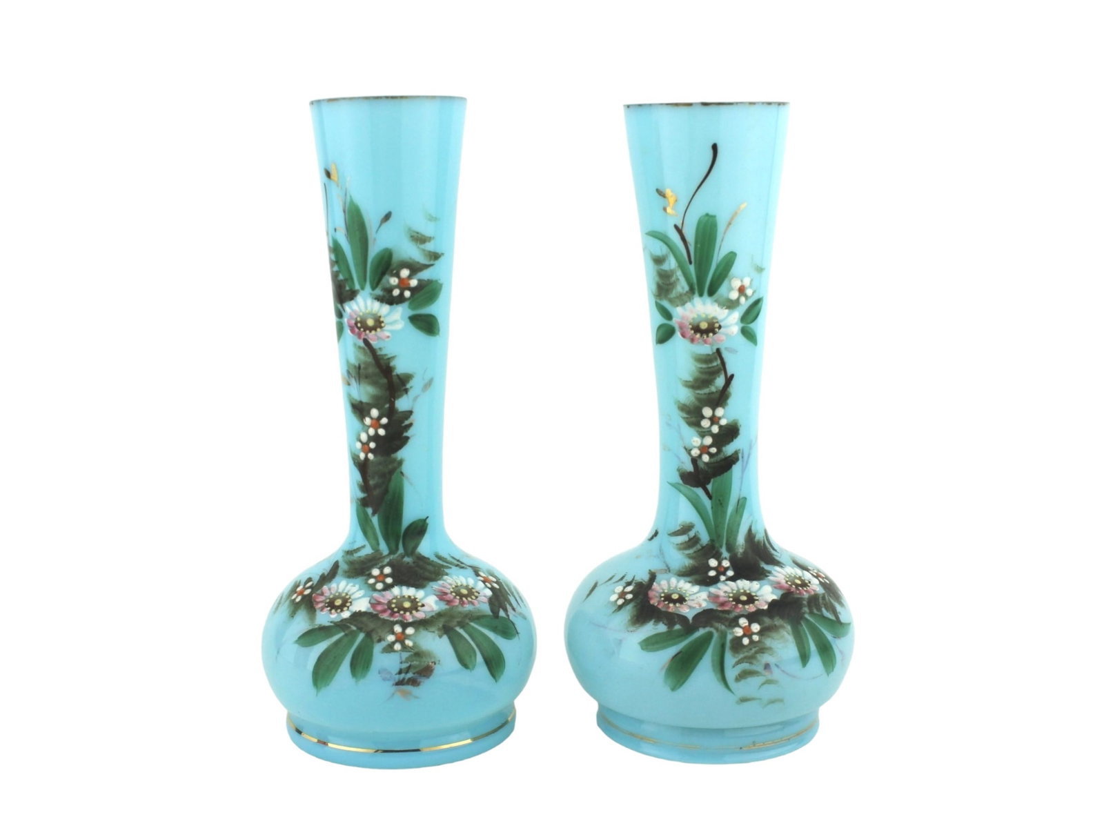 Two 19th C. Hand-Painted Blue Opaline Glass Vases: Charming pair of antique blue opaline glass vases featuring hand-painted floral designs with enamel detailing and gold trim. Both in 7 1/4 in. in height. In good condition overall.