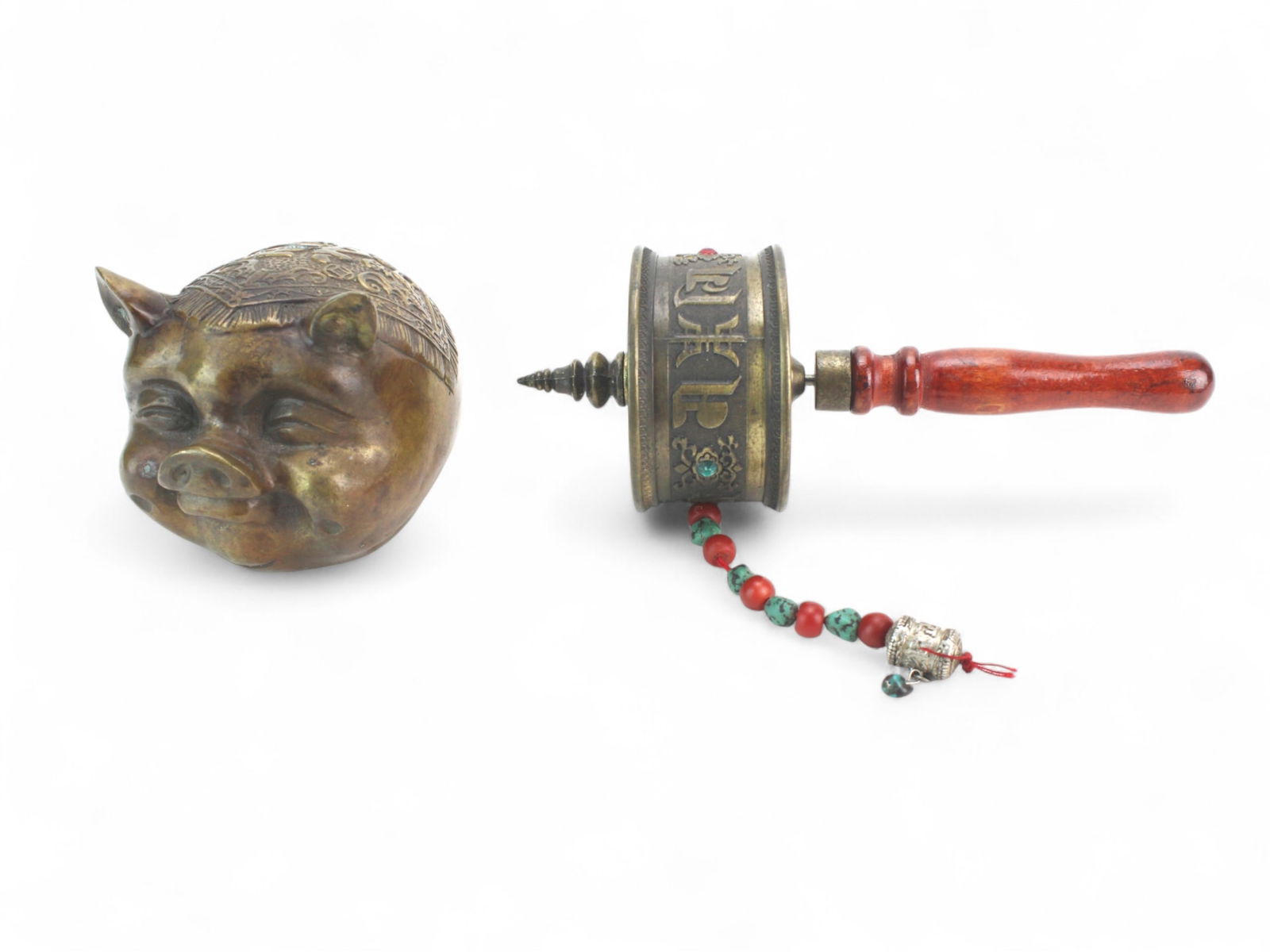 Bronze Pig Form Figure and Tibetan Prayer Wheel: Pair of decorative bronze items: an engraved pig figure and a Tibetan-style prayer wheel with turquoise and coral inlay. Both show light wear and patina consistent with age; largest approx. 8 in. L.