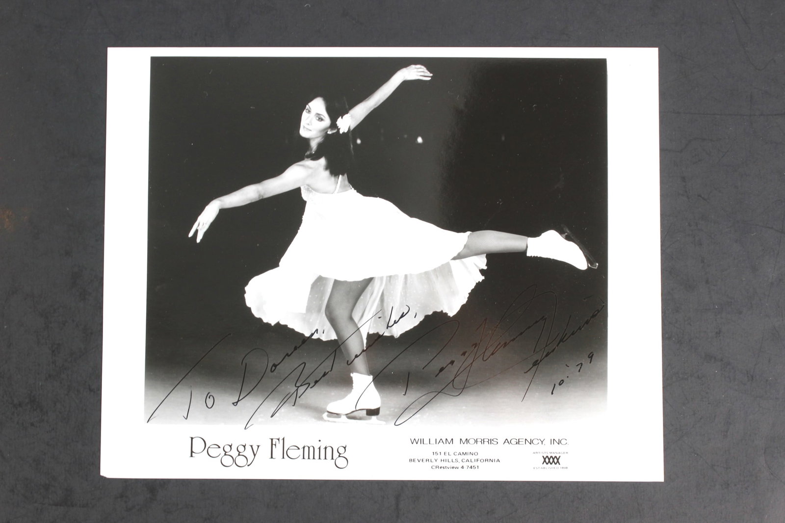 Peggy Fleming Signed Skating Photo: Vintage black and white 8x10 photo of figure skating icon Peggy Fleming in a graceful performance pose. Boldly signed and inscribed “To Doris, Best Wishes” with date “10-79.” In good