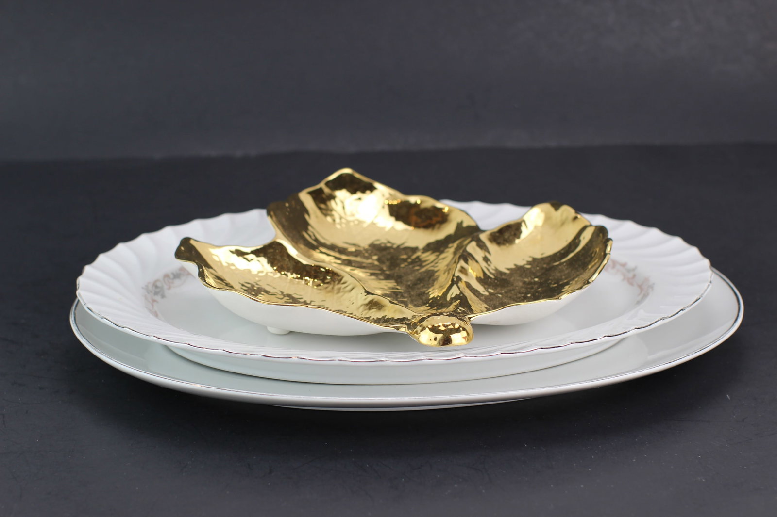 Three Porcelain Platters: Includes one Raymond Loewy Continental China fish platter in 15 X 11 in.; one Japan Royale 5205 Wentworth Fine China fish platter in 14 1/4 X 10 1/4 in., with hairline; and one England Royal Winton