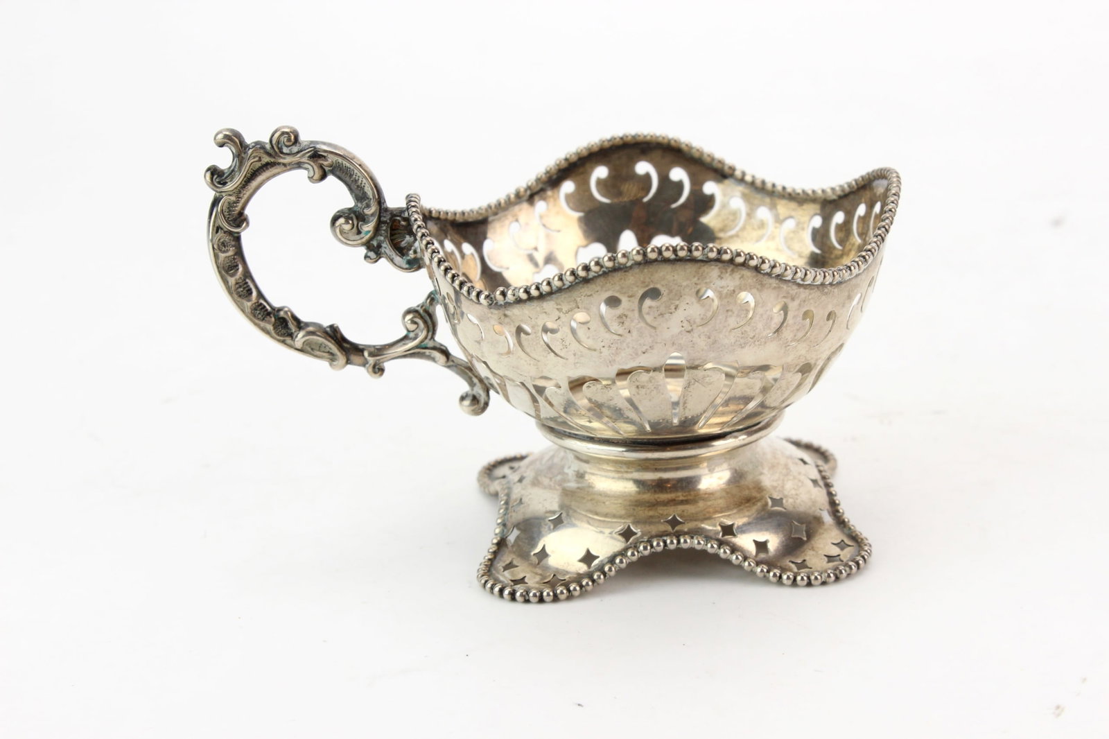 Sterling Silver Pierced Cup: Sterling silver pierced cup with ornate scroll handle, scalloped rim, and decorative openwork body on a shaped pedestal base. Marked "STERLING .925 FINE 1000" on the interior. Measures approximately