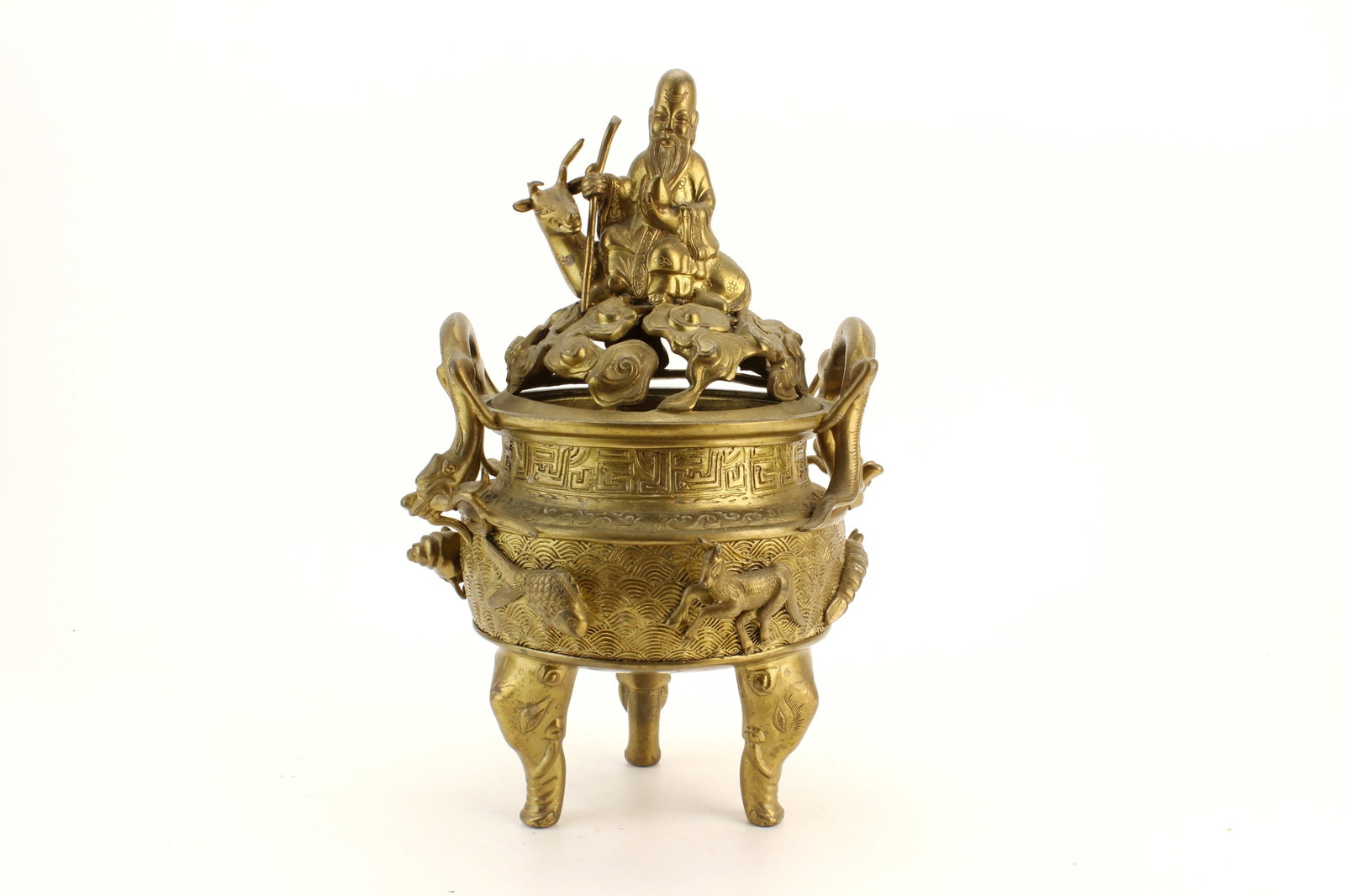 Asian Bronze Tripod Incense Burner: Asian bronze tripod incense burner with a reticulated cover surmounted by an immortal riding a deer, dragon-form handles, and relief decoration of animals around the body. Mark to the underside.