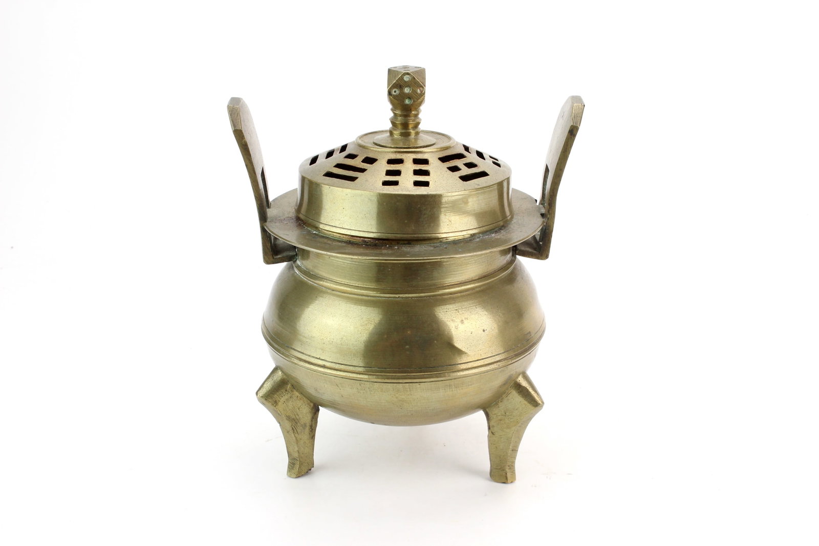 Asian Bronze Tripod Censer: Asian bronze tripod censer with a pierced domed cover featuring Eight Trigrams motifs, upright handles, and three tapered legs. Measures approximately 7 in. (H) ? 5 1/2 in. (L) ? 5 in. (W). Condition:
