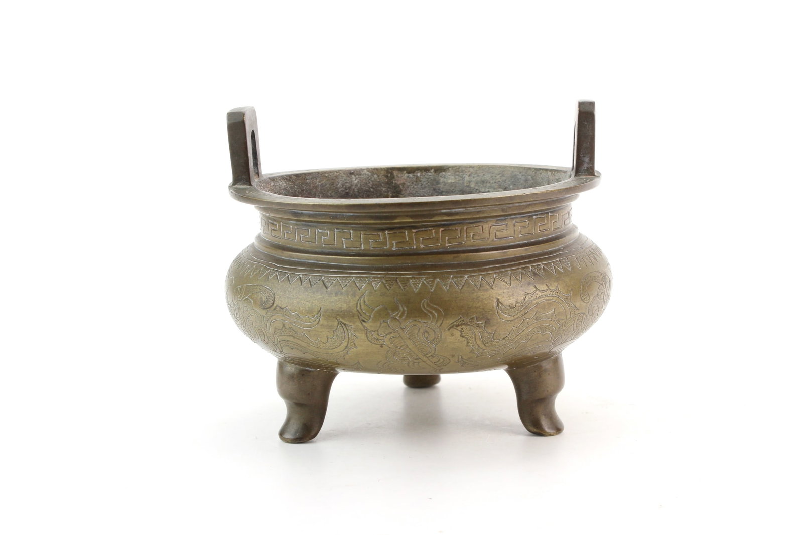 Chinese Bronze Tripod Censer: Chinese bronze tripod censer with upright loop handles, engraved dragon and geometric decoration, and an apocryphal Xuande-style mark to the base. Measures approximately 5 in. (D) ? 4 in. (H). Conditi