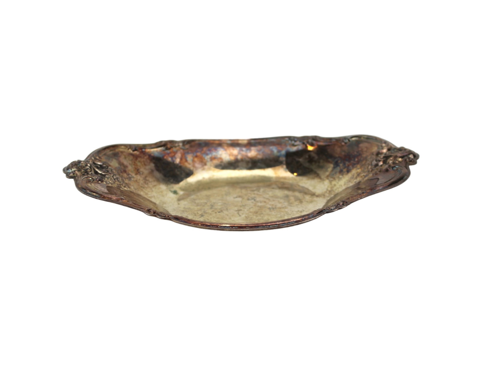 International Silver Co 448 Silver Plate Tray: Ornate silver plate tray by International Silver Co., marked ?448.? Approx. 8 1/2 inches (L) X 5 1/2 inches (W) X 1 inches (H). Features floral scrollwork on handles and rim. Surface shows tarnish,