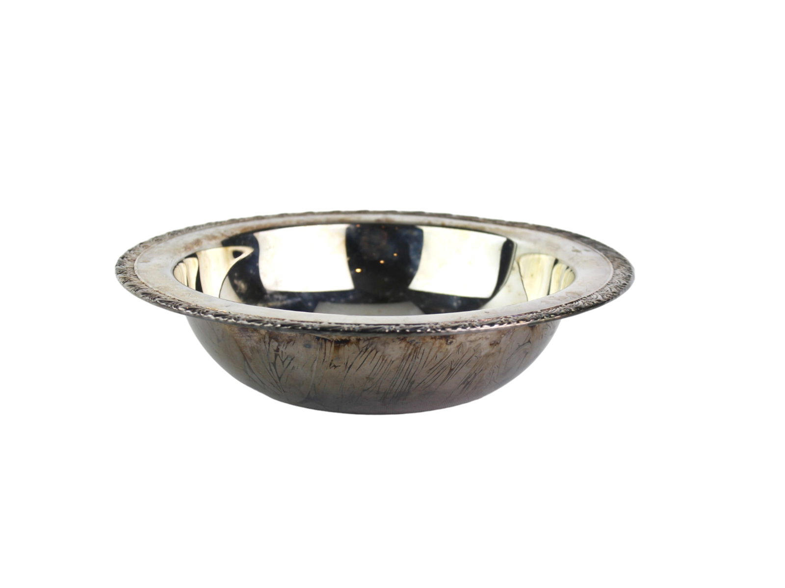 Vintage Silverplate Basin: A vintage silverplate basin with an ornate floral rim and rounded form, measuring approx. 10 1/4 in. (D) x 2 1/2 in. (H). The interior remains relatively bright, while the outer surface shows