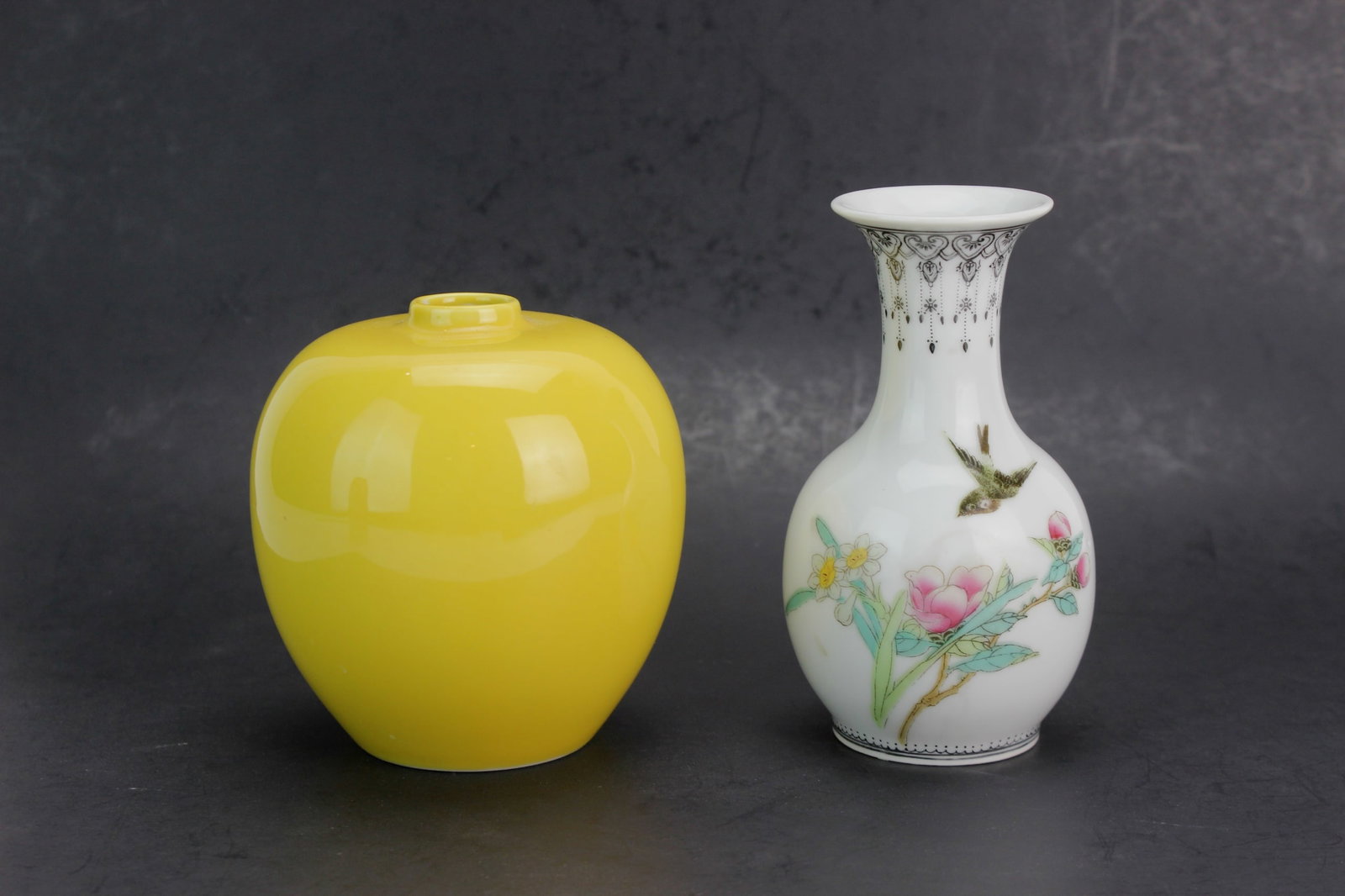 Yellow Jar & Famille Rose Vase Set: A pair of porcelain pieces including a glossy yellow-glazed jar (4 in. H) and a hand-painted Famille Rose vase (5 in. H) with floral and bird motifs. Both are in excellent condition and ideal for