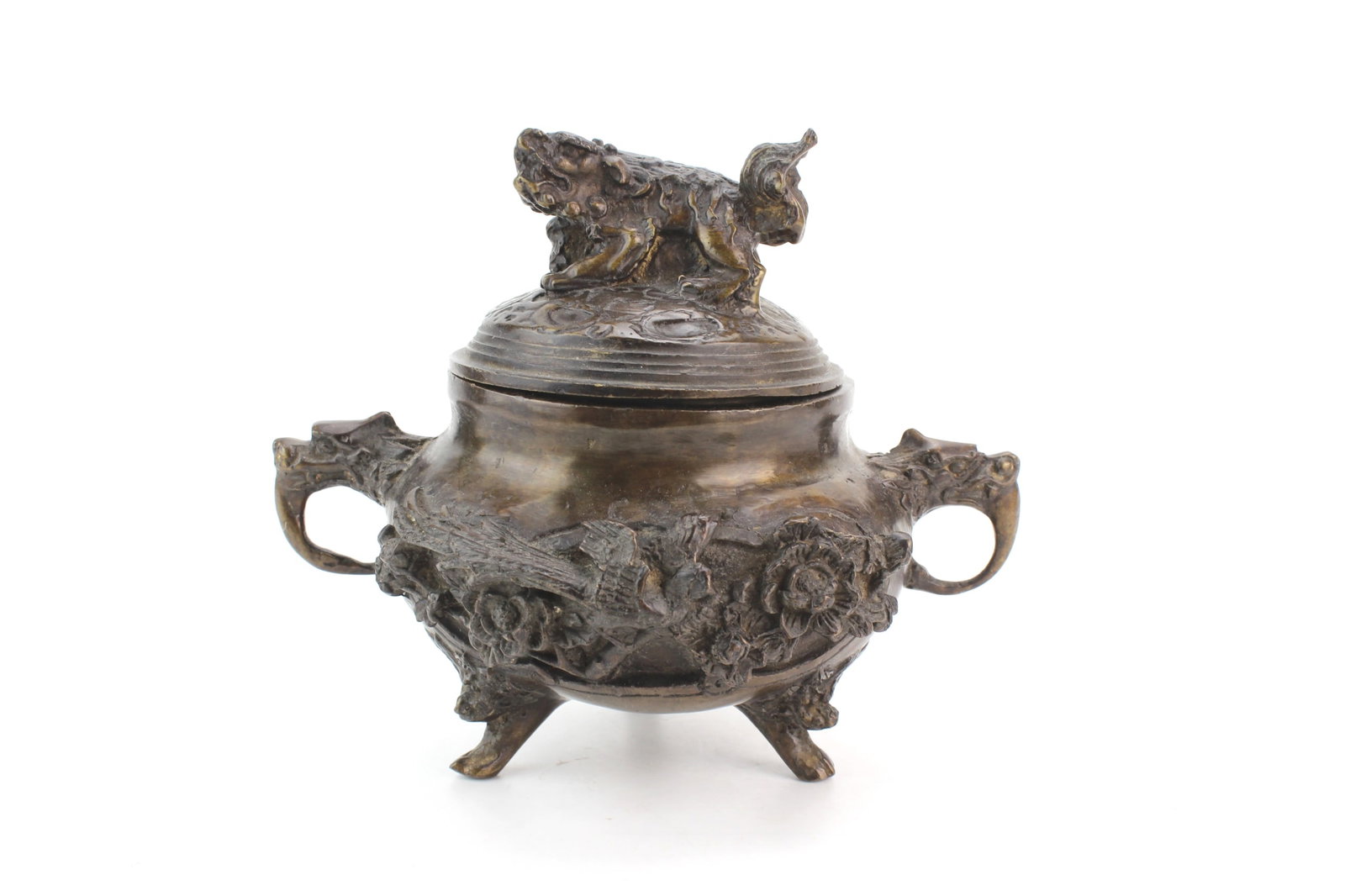 Chinese Bronze Lidded Censer: Chinese bronze lidded censer with foo dog finial, twin handles, and relief bird and floral motifs. Measures approx. 6 in. (H) x 7 in. (L) x 5 1/2 in. (W). Shows surface wear, scratches, oxidation,
