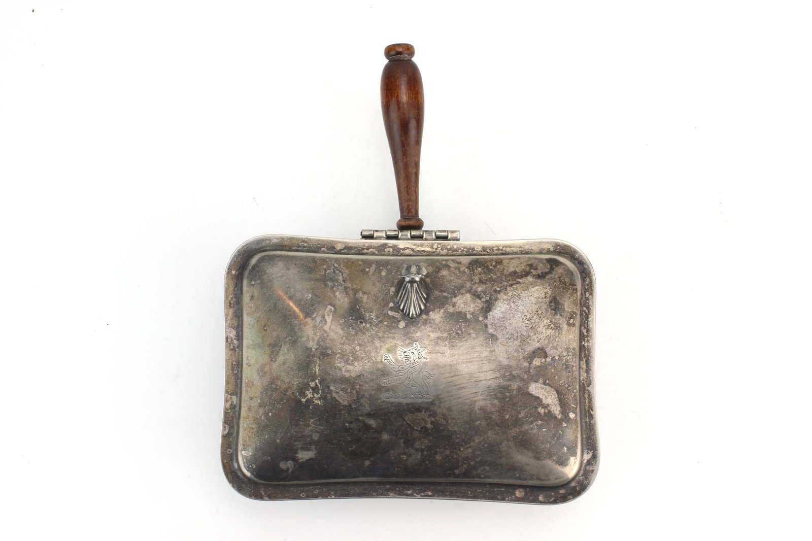 Silverplate Covered Serving Dish: Silverplate covered serving dish with wooden handle and decorative feet. Measures 9 1/2 in. (L) X 7 1/2 in. (W) X 3 1/4 in. (H). Shows heavy tarnish, surface wear, scratches, and oxidation consistent