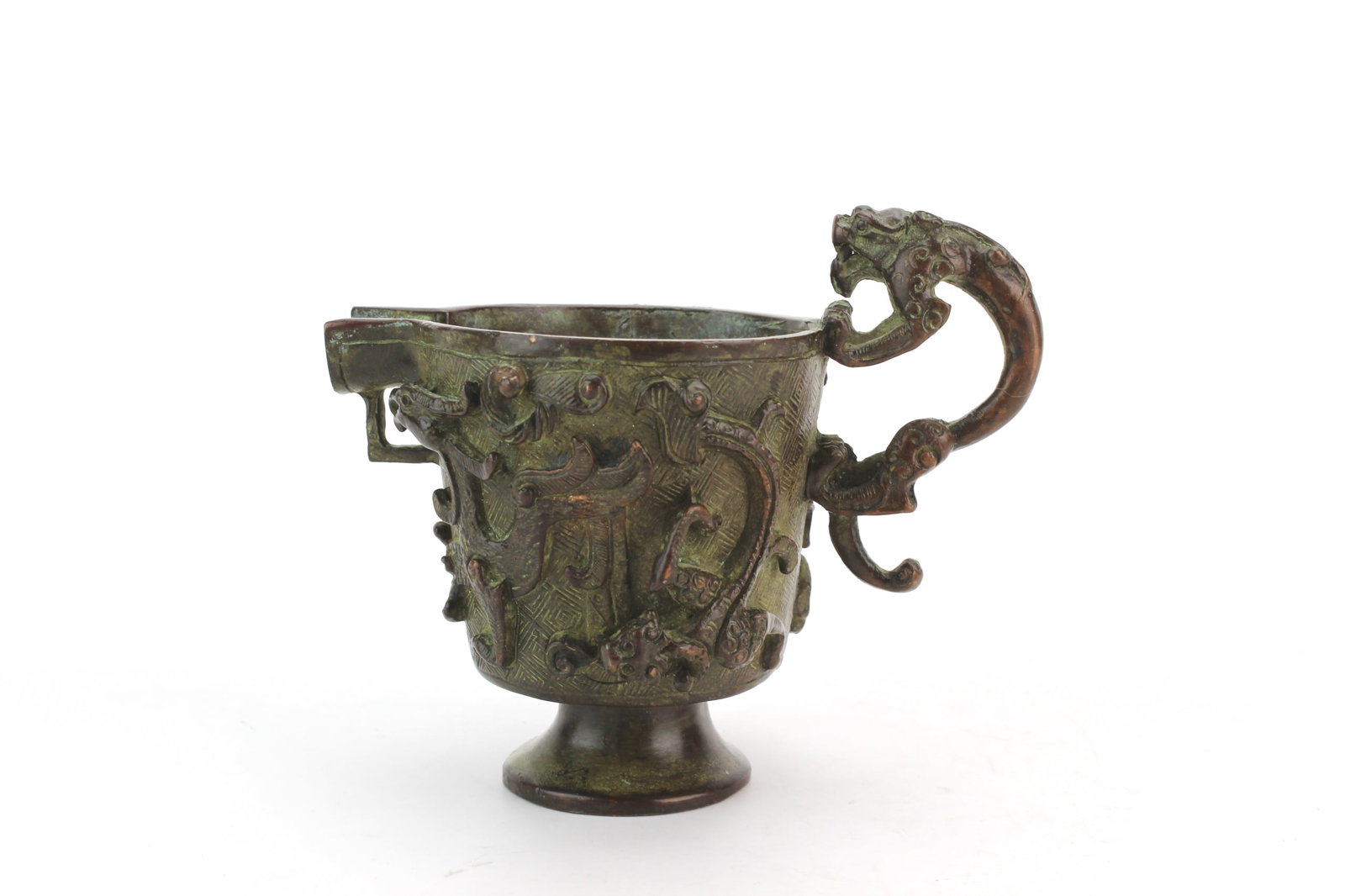 Chinese Archaic Style Bronze Cup: Chinese archaic style bronze cup with relief decoration, mythical beast handles, and pedestal foot. Measures approximately 4 1/2 in. (L) X 2 3/4 in. (W) X 3 3/4 in. (H). Exhibits surface wear, oxidati