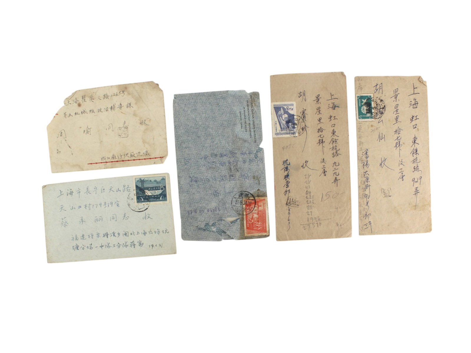 Group of Five 1950S Chinese Postal Covers: Group of five Chinese mail covers from the 1950s, each with handwritten addresses and domestic postage stamps, all sent to Shanghai. Covers show postal marks, notes, and wear consistent with age and