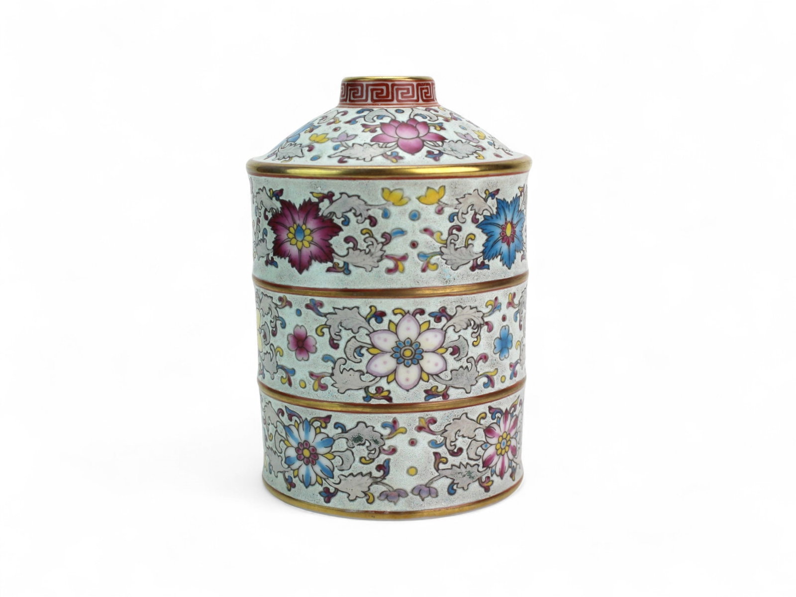 Chinese Famille Rose Floral Three-Tiered Jar: Chinese famille rose porcelain jar with domed lid and three stacking sections, finely enameled with scrolling lotus and floral motifs in pink, blue, yellow, and turquoise, with gilt rims and red
