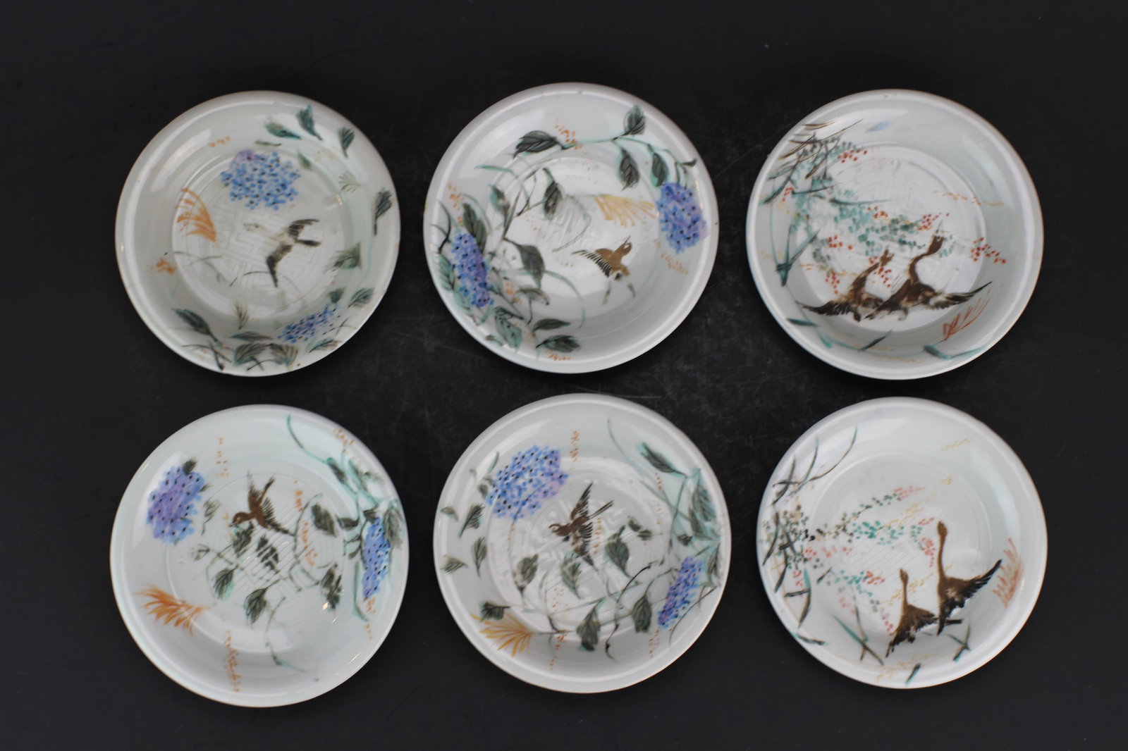 Six Asian Hand Painted Porcelain Saucers: The dish measures Approx. 4 3/4 in. (D). Three dishes with hairlines.