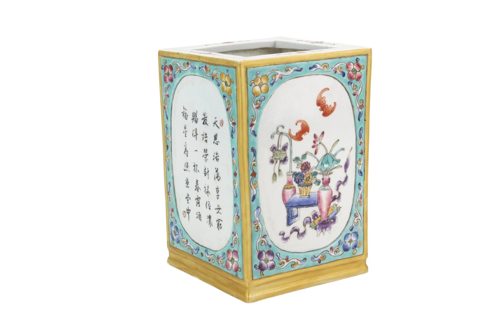 Chinese Famille Rose Square Brush Pot: Chinese famille rose porcelain square brush pot decorated with colorful floral arrangements, auspicious objects, turquoise floral borders, and calligraphy panels. The base bears a red four-character m