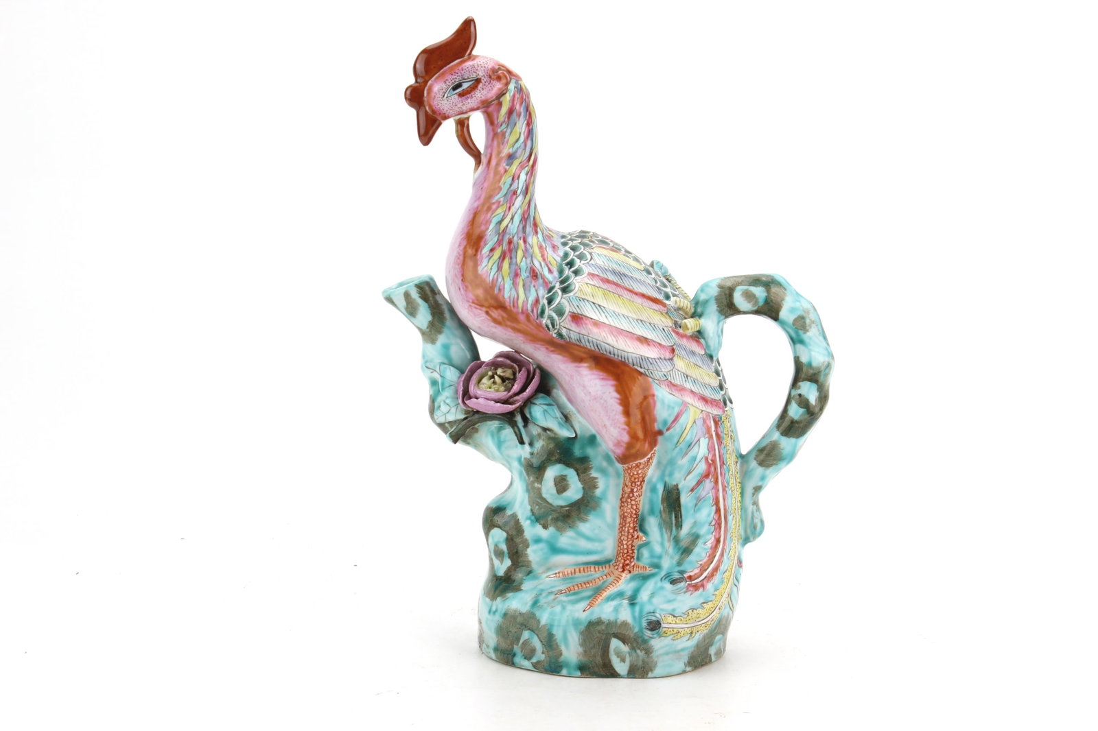 Chinese Famille Rose Phoenix Teapot: Chinese famille rose porcelain teapot modeled with a colorful phoenix perched atop the vessel, decorated with polychrome enamels, floral detail, loop handle, and spout. Measures 10 in. (L) x 7 1/2 in.