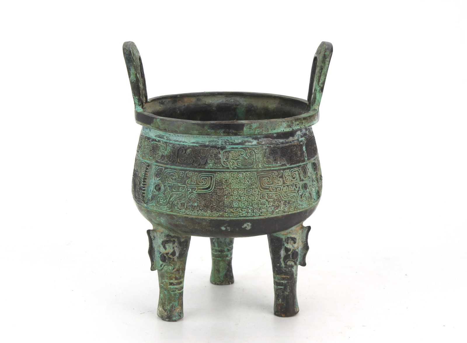 Chinese Archaistic Style Bronze Tripod Censer: Chinese archaistic style bronze tripod censer with rounded body, two upright handles, three legs, and raised geometric and stylized decorative motifs. Inscription/mark visible on the underside.