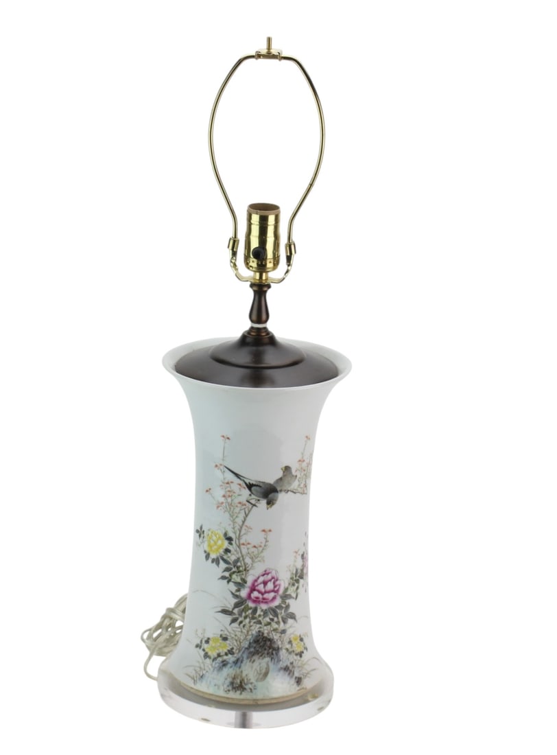 Chinese Famille Rose Porcelain Vase Lamp: Chinese famille rose porcelain vase mounted as a table lamp, decorated with birds, flowering plants, and Chinese calligraphy. Fitted with metal lamp hardware, harp, dark wood-tone top fitting, and cle