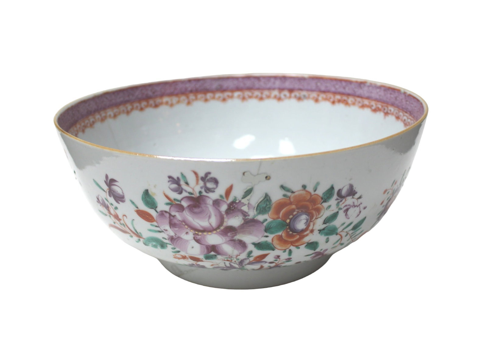 A Chinese Export Famille Rose Punch Bowl: This is a Chinese export porcelain punch bowl, likely from the Qing Dynasty, decorated in famille rose enamel with floral motifs. The exterior and interior both feature colorful hand-painted flowers